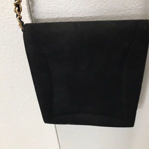 Black evening bag. Chain is 45 in. Long. Bag is 8 by 6 1/2.